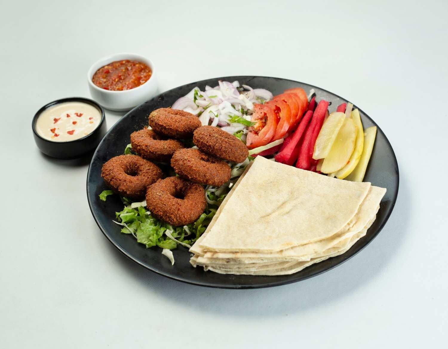 How Is Falafel Traditionally Served?