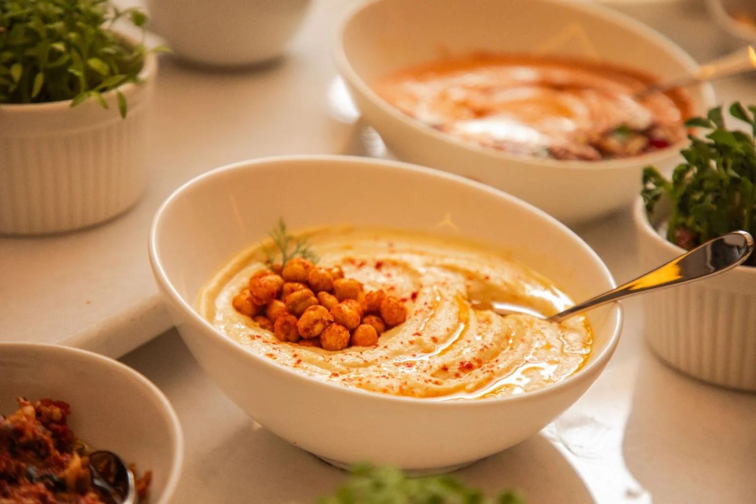 Creamy hummus drizzled with olive oil.