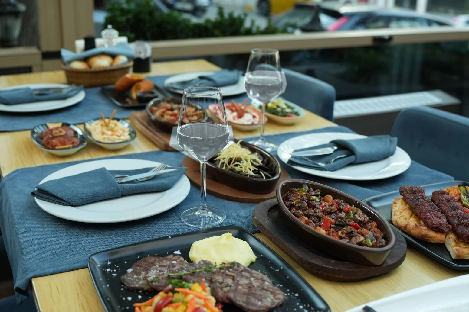 A beautifully set table in a restaurant with various halal dishes, perfect for fine dining.