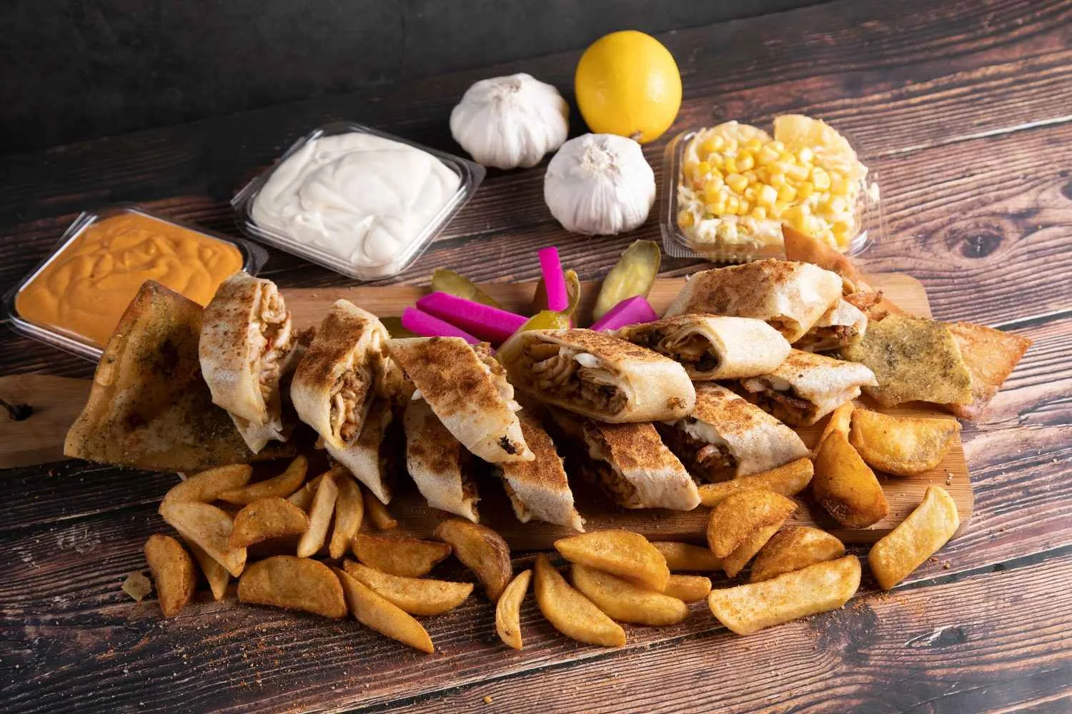 Delicious Middle Eastern wrap platter with fries, served with garlic aioli and hummus.